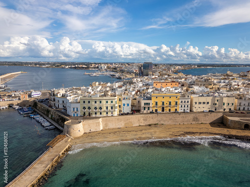 Aerial drone view of the coastal town named Gallipoli at the mediterranean sea in Italy. photo