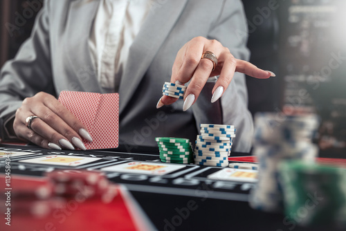 Wallpaper Mural female player plays poker and takes chips to raise the bet Torontodigital.ca