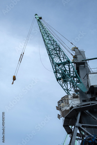 Towering Industrial Crane Against a Clear Sky