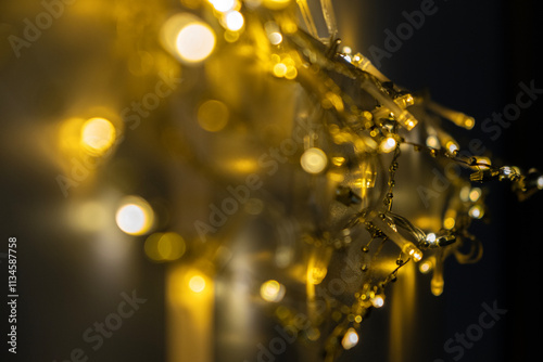 Abstract background. Warm yellow Christmas lights. Soft bokeh.