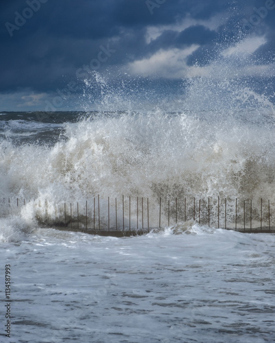 Stormy sea waves, sea foam and water splashes. Nature background