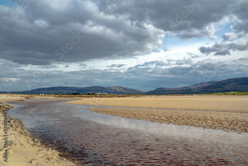 The stream that flows from Sheskinmore Nature Reserve to Ballinravey Strand between Ardara and Portnoo in Donegal - Ireland photo