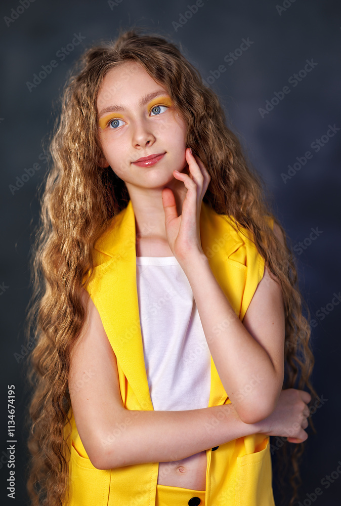 Portrait of a emotional beautiful girl kid isolated on black background. Teen girl in studio shot. Advertising child