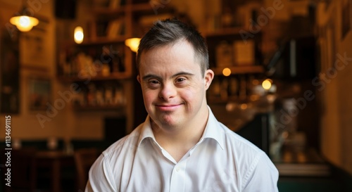 Young caucasian male with down syndrome smiling in cozy cafe setting