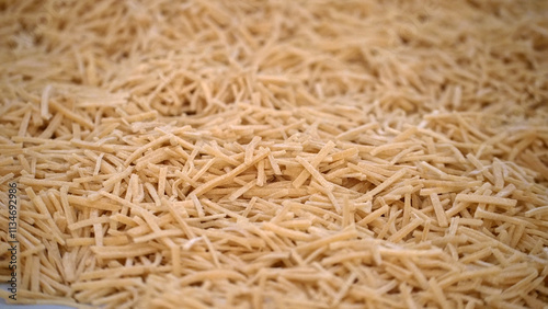 Cutting noodles from homemade natural wheat flour dough,