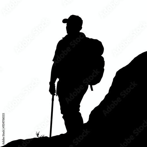 Silhouette of a hiker with a backpack and a walking stick on a mountain trail.