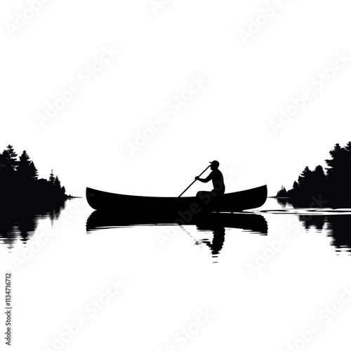 Silhouette of a man in a canoe on a still lake.