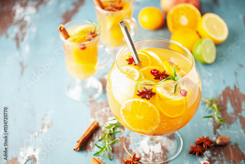 Homemade hot alcohol mulled apple cider punch with cinnamon sticks, anise star and spices
