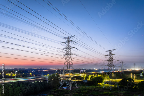 High voltage electric tower and natural scenery at dusk photo
