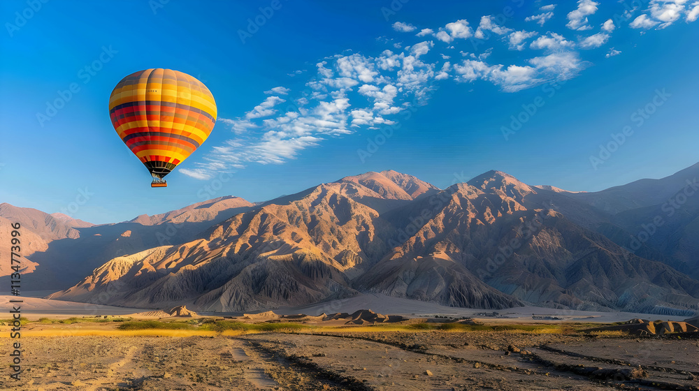 Hot air balloon over a desert mountain. Hot air balloon over a desert mountain.