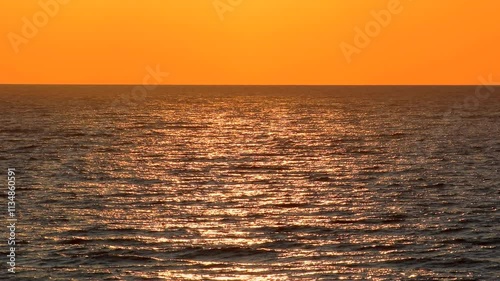 Beautiful sunset over the sea. Ocean, aqua, nature, land, lake, water, waves, wavy, ripple, tide, sun, bright, magic, sky, color, travel, peace, relax, calm, dark, scene, view, full hd. ProRes 422HQ