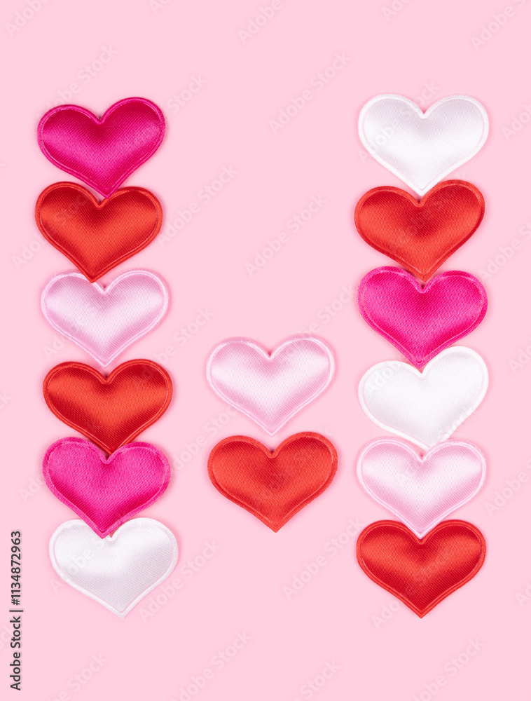 Letter W made of glossy atlas hearts isolated on solid pink background. Love alphabet concept. One letter of the set of heart's font easy to stacking. Letter W made of glossy atlas hearts isolated on solid pink background. Love alphabet concept. One letter of the set of heart's font easy to stacking.