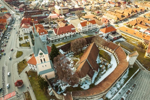 Majestic mountains embraced by quaint villages and historical architecture create a captivating aerial view of Piatra Craiului, Rasnov, and Plaiul Foii. Nature and heritage unite photo