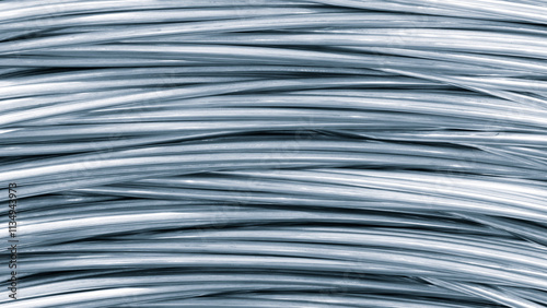 A long metal silver wire is shown in the image. It is a single strand of wire metal background photo