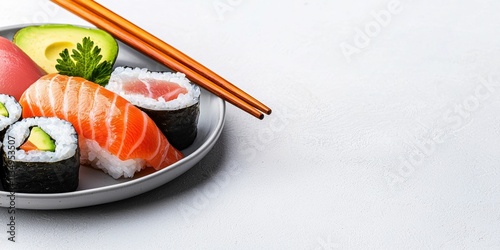 Sushi platter with fresh ingredients and chopsticks. photo