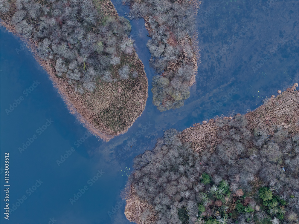 Φωτογραφία Dramatic aerial drone landscape imsge of Loughrigg Tarn in Autumn in Lake Distri