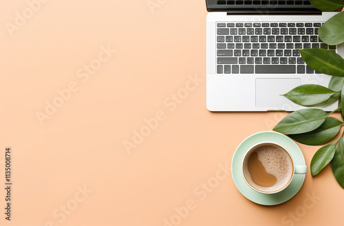 A flat lay of an open laptop on a pastel background, with a cup of coffee and green leaves beside it. Creating a cozy home office vibe.