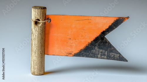 An orange and black rustic flag waves, stirring feelings of adventure and storytelling photo