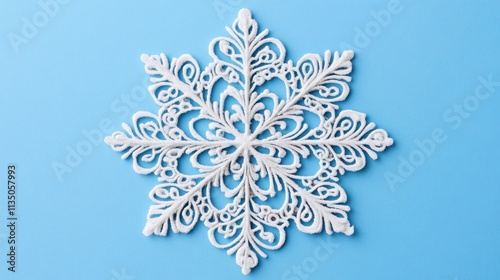 Ornate White Snowflake on Blue Background