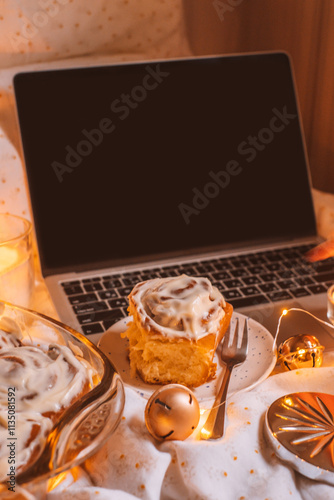 Christmas flatlay with cinnamon rolls and candles