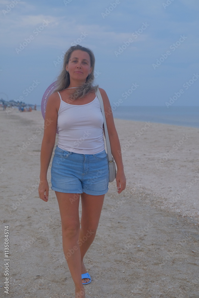 person walking on the beach
