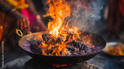 Sacred fire ritual with burning wood and ceremonial offerings photo