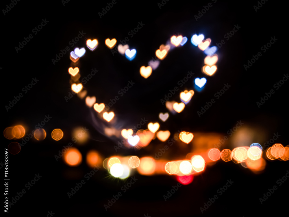 background bokeh with love shaped light on dark