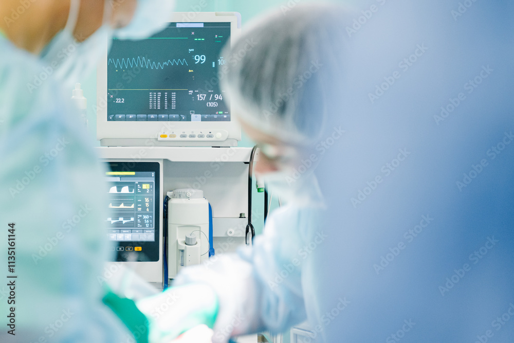 The medical team is engaged in a critical surgical procedure in a sterile environment of an operating room for patient health
