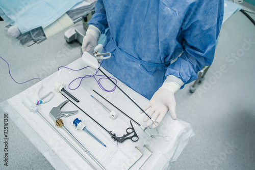 Obraz na płótnie A skilled medical professional precisely prepares essential surgical instruments in a controlled operating room setting, w salonie