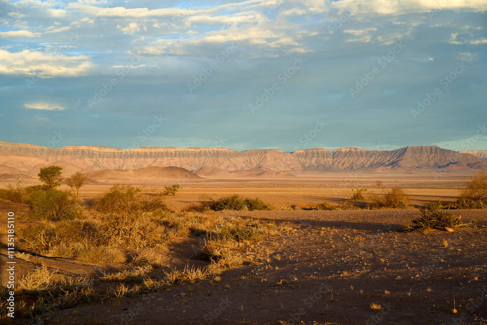 Desert views at dusk during a guided trek in Sossusvlei, Namibia Desert views at dusk during a guided trek in Sossusvlei, Namibia