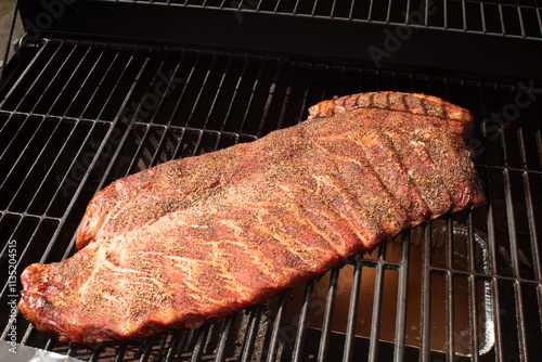 Pork spare ribs cooked and smoked on the barbeque