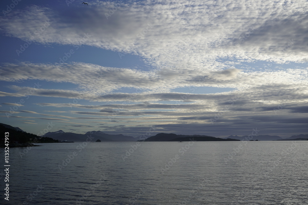 White nights in the fjords of Norway. Horizon and ferry crossing. Sky and clouds. White nights in the fjords of Norway. Horizon and ferry crossing. Sky and clouds.