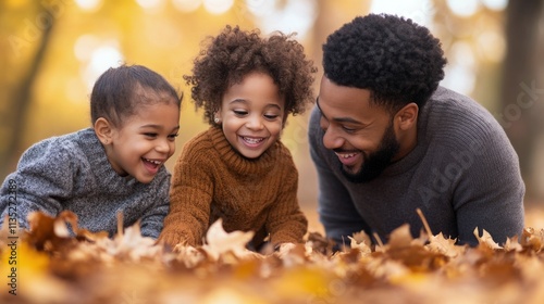 Family enjoys playful moment together in autumn leaves at a park