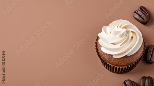 Chocolate cupcake with cream frosting and coffee beans on a smooth surface