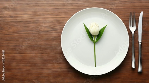 A Single White Tulip Gracefully Adorns a Place Setting photo