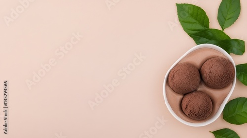 Creamy dessert jars with chocolate pieces and mint leaves on a dark background