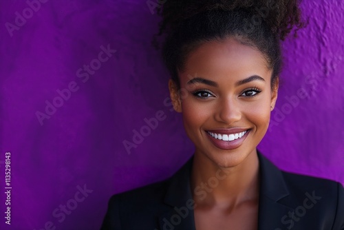 Confident young businesswoman smiling brightly in a professional headshot with a vibrant purple background. Ideal for themes of diversity, leadership, and modern workplace.
