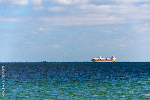 Container ship on sea with copy space on heaven and water, sunny day photo