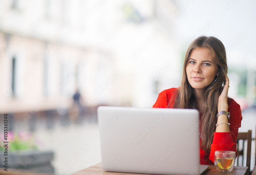 Young businesswoman on a coffee break. Using tablet computer. Young businesswoman on a coffee break. Using tablet computer.