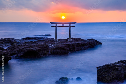 秋の神磯の鳥居と日の出　干潮時　茨城県大洗町　Autumn Kamiiso-no-torii and sunrise. At low tide. Ibaraki Pref, Oarai Town. photo