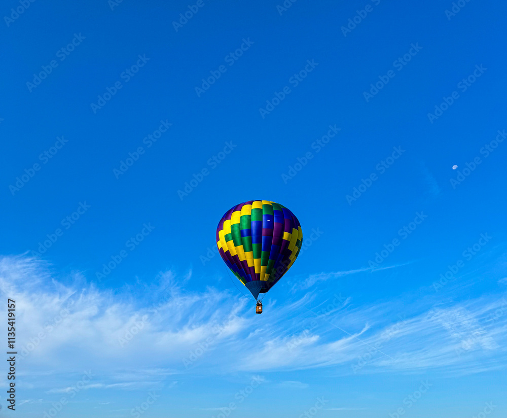 Colorful Hot Air Balloon Floating in the Clear Blue Sky Colorful Hot Air Balloon Floating in the Clear Blue Sky