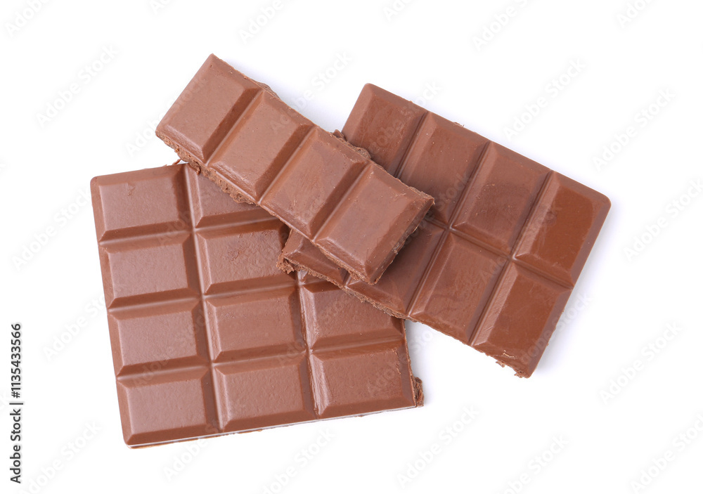 Pieces of delicious milk chocolate isolated on white, top view Pieces of delicious milk chocolate isolated on white, top view
