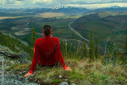 girl enjoying view to the nature and dempster highway yukon photo