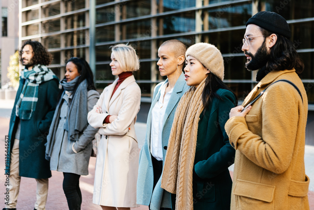 Large group of business people standing together at city street. Teamwork and professional corporate colleagues concept. Large group of business people standing together at city street. Teamwork and professional corporate colleagues concept.