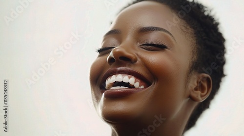 Joyful Black Woman Laughing with Natural Beauty and Radiant Smile