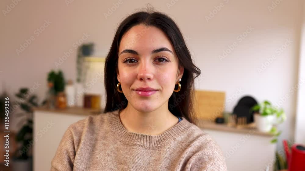 Confident young woman smiling with crossed arms in a bright and airy domestic kitchen, radiating positivity and motivation while working remotely Confident young woman smiling with crossed arms in a bright and airy domestic kitchen, radiating positivity and motivation while working remotely