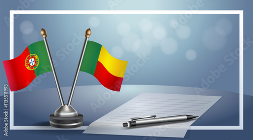 Portugal and Benin National flags on small table with bokeh background, cooperative relationship