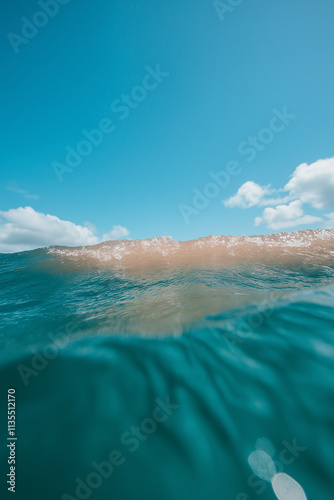 tropical background image, pristine beach, empty, negative space, holiday tropical secret getaway,  blue sky, perfect for advertising, ocean, warm water photo