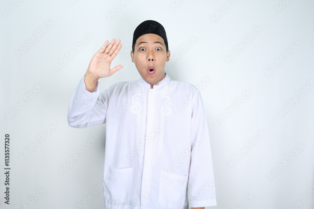 shocked muslim man asian waving hand to give greeting isolated on white background shocked muslim man asian waving hand to give greeting isolated on white background