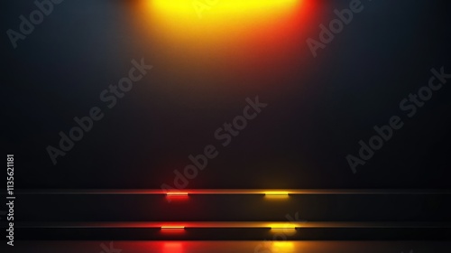 A sleek, matte black wall with a glowing yellow light at the top, shining downward. Three colorful lights at the bottom glow upward, one in deep red. photo